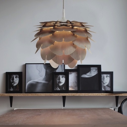 Aiko Mini Cappuccino lamp in a room with chinese girl photos, table and chairs.